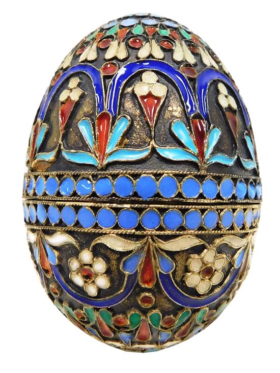 Appraisal: RUSSIAN SILVER Champlev enamel egg decorated in turquoise cobalt violet