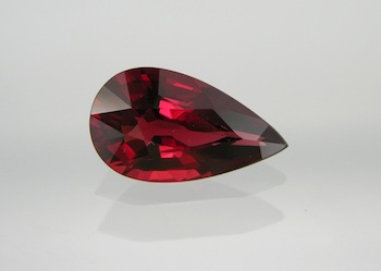 Appraisal: A Large Pear Cut Pyrope Garnet Carat A brilliant pear