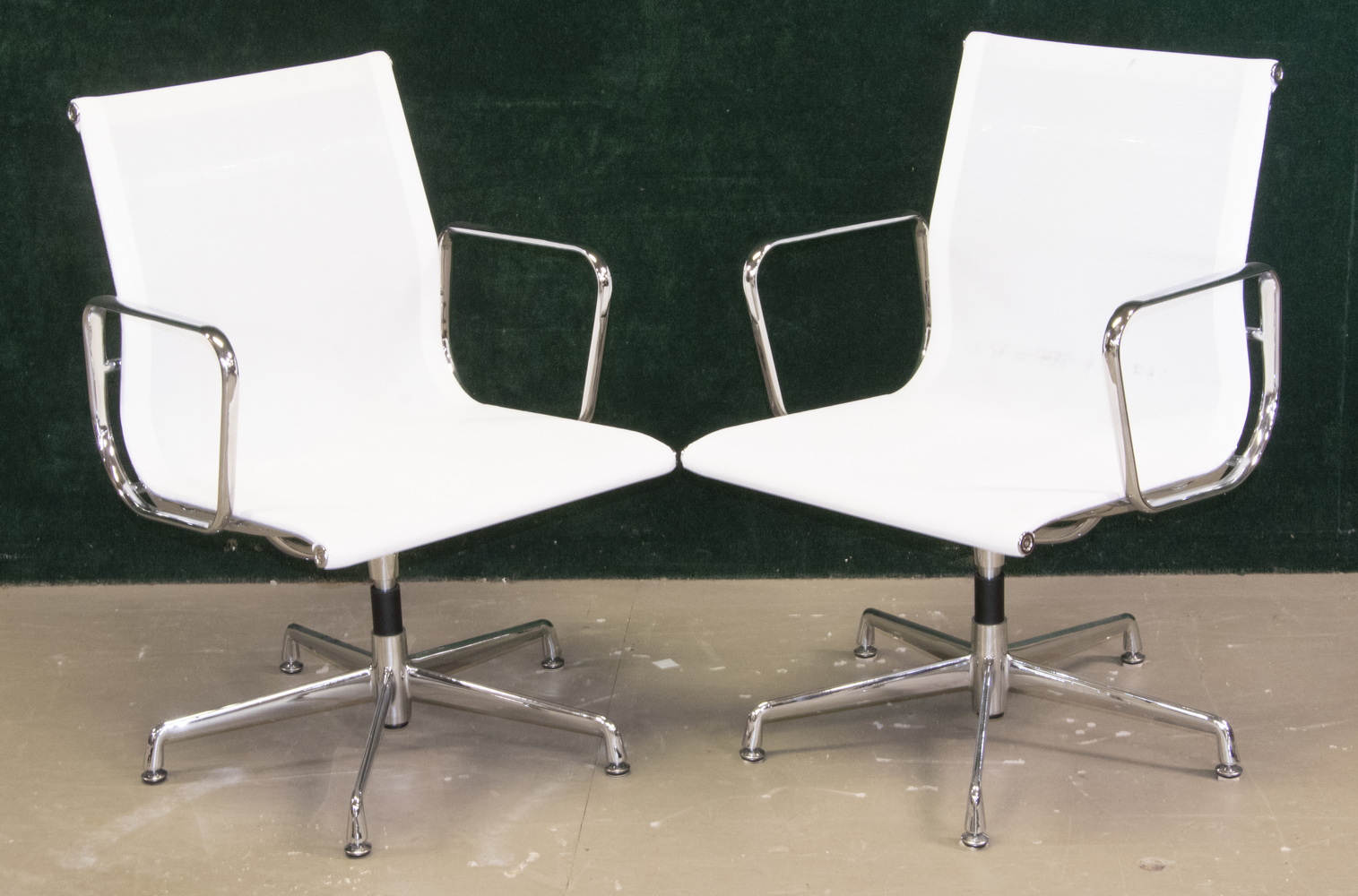 Appraisal: PR OF CHROME EAMES OFFICE CHAIRS WITH MESH SEATS Modern