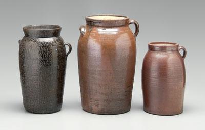 Appraisal: Three Georgia stoneware churns one with mottled brown black glaze