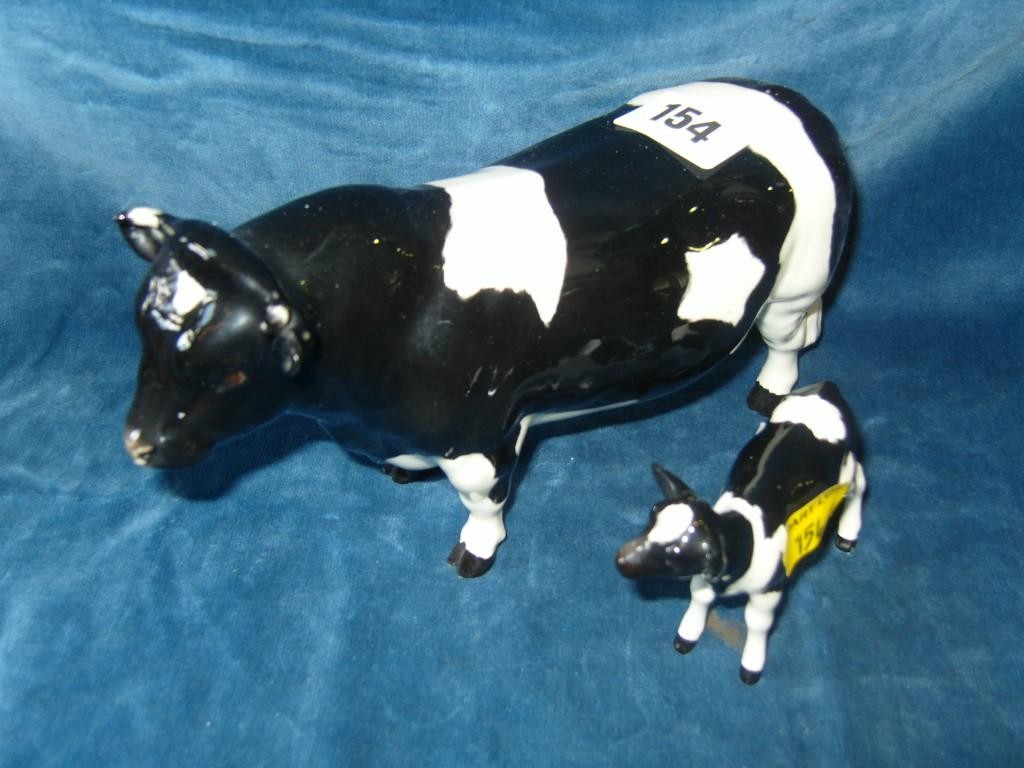 Appraisal: A Beswick model of a Friesian bull together with a