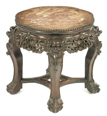 Appraisal: A Chinese carved hardwood low stand with an inset marble