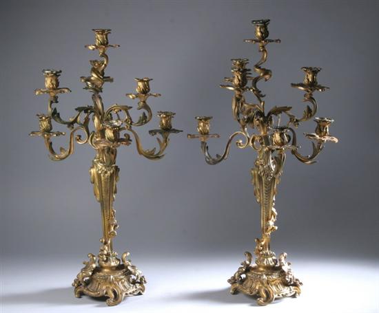 Appraisal: PAIR LOUIS XV-STYLE BRONZE-DOR SEVEN-LIGHT CANDELABRA th century Scrolling bases