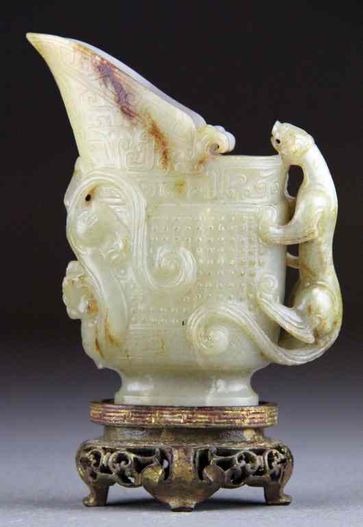 Appraisal: A Fine Chinese Qing Carved Jade RythonFinely carved in celedon