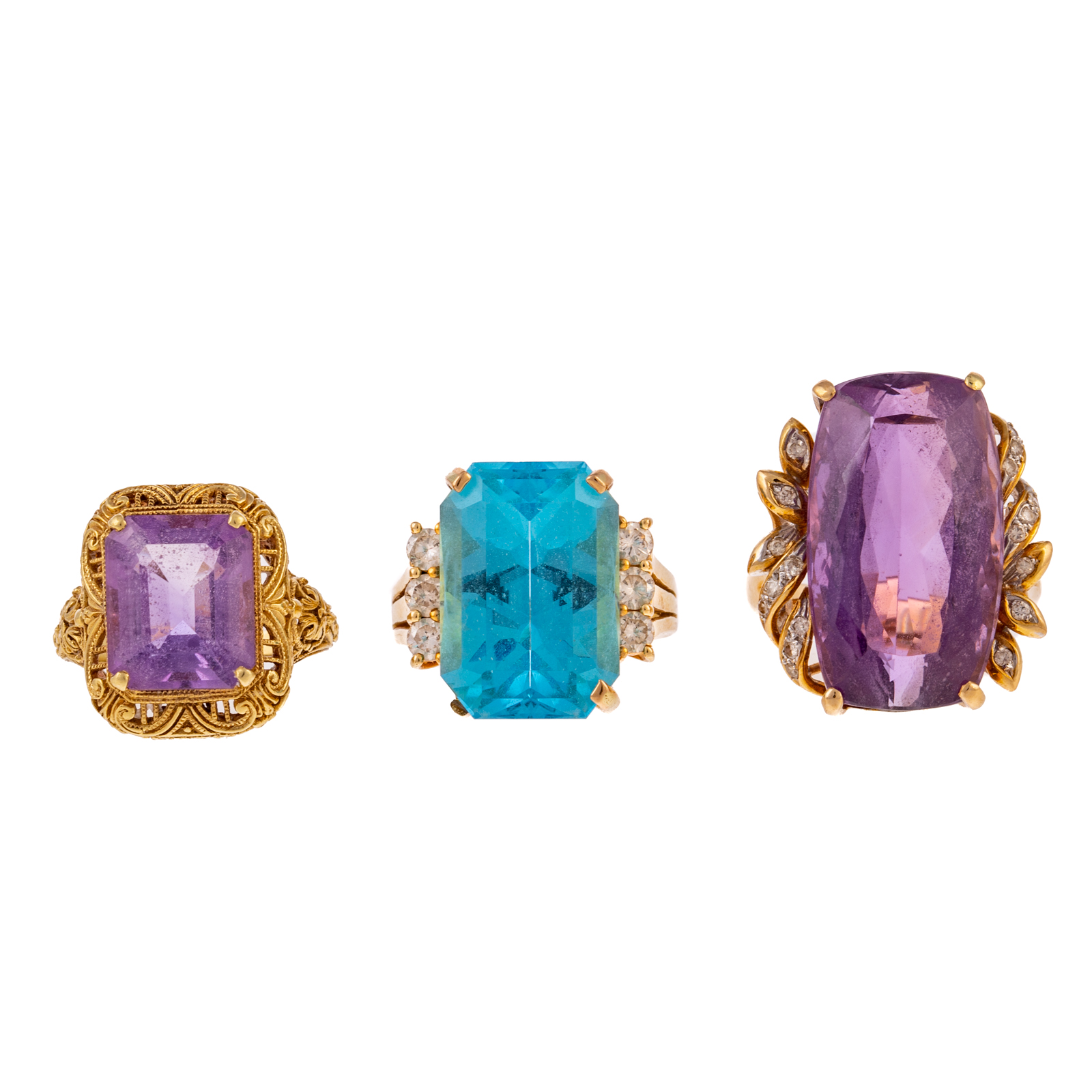 Appraisal: A TRIO OF GEMSTONE RINGS IN K YELLOW GOLD K