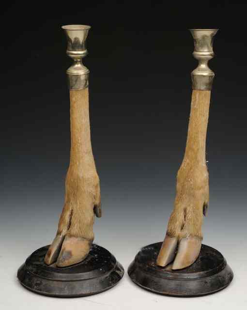 Appraisal: A PAIR OF ANTELOPE HOOF CANDLESTICKS mounted by P Spicer