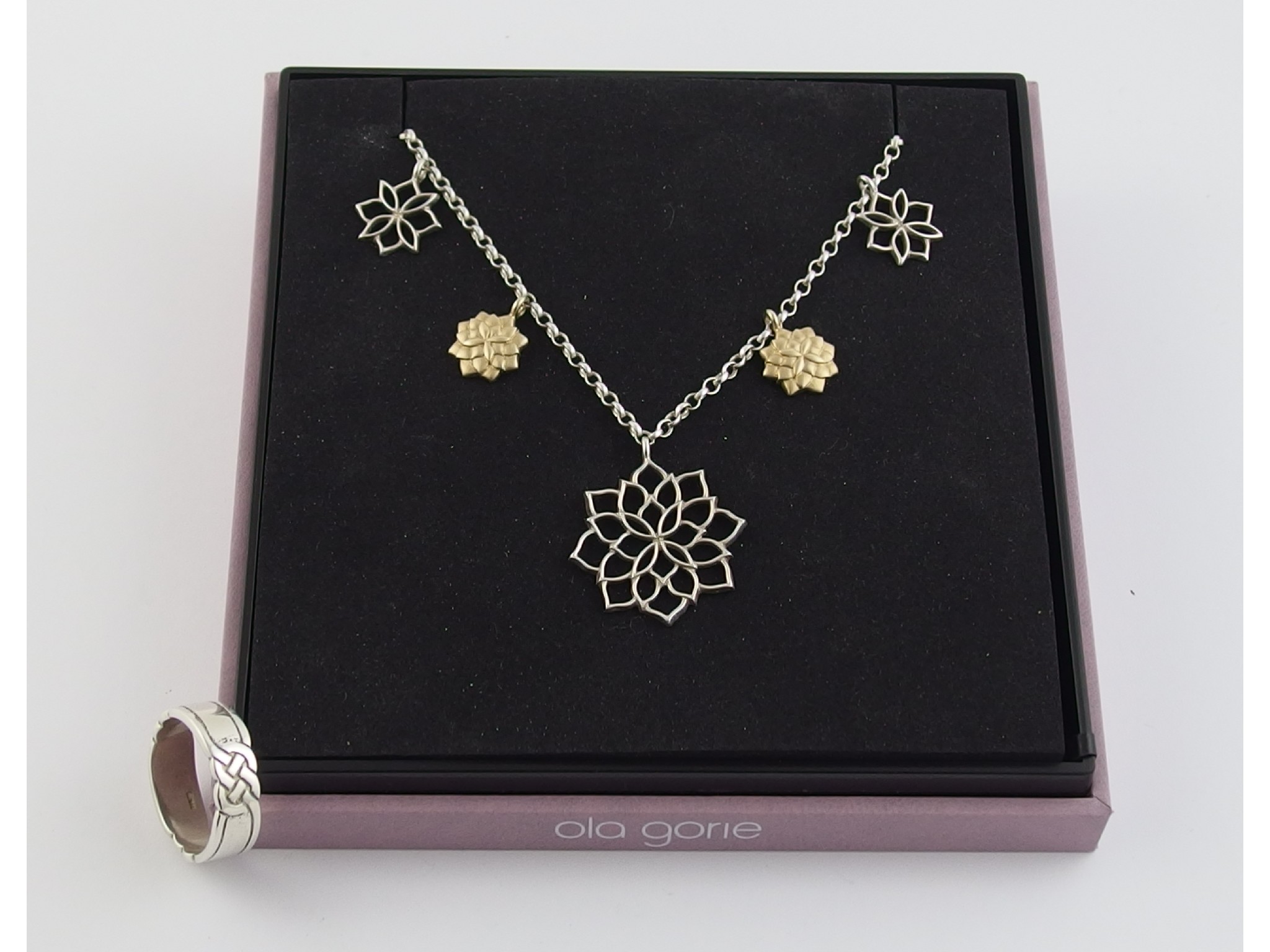 Appraisal: An Ola Gorie silver flower necklace with attached ct flower