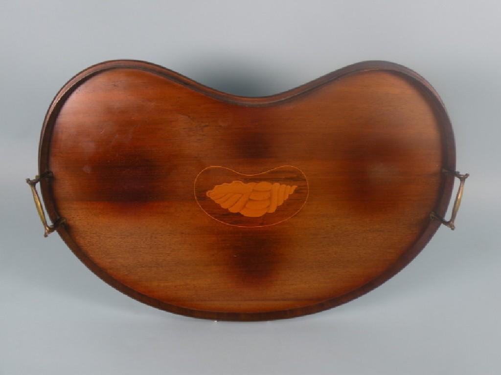 Appraisal: An Edwardian mahogany kidney shaped tray inlaid to the centre