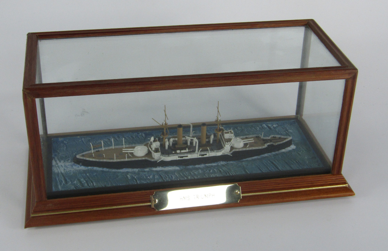 Appraisal: A scale model of an ironclad battleship HMS Triumph cased