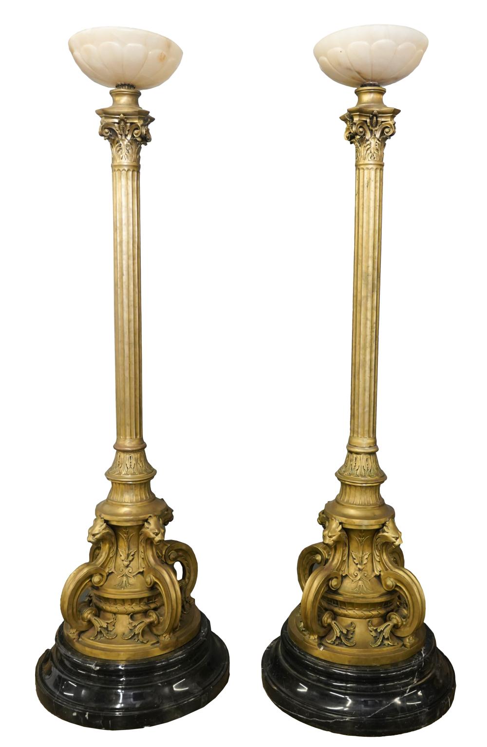 Appraisal: PAIR OF GILT METAL ALABASTER TORCHIERESeach on a later black