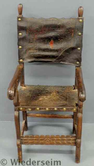 Appraisal: Spanish walnut armchair probably th c with paint decorated leather