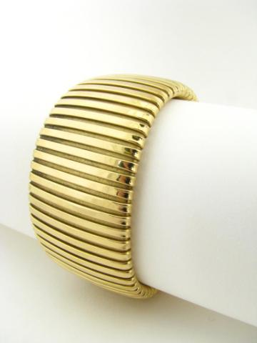 Appraisal: Tiffany K yellow gold flexible cuff bangle signed dwt with