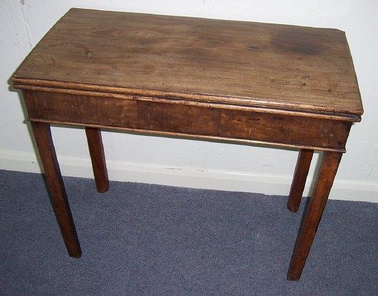 Appraisal: A George III mahogany card table the rectangular fold-over top