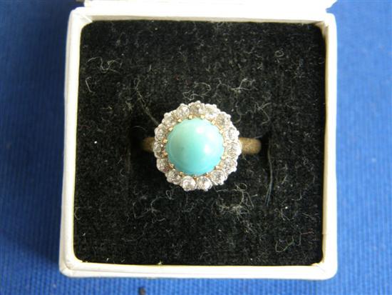 Appraisal: Cluster ring set with a cabochon turquoise and surrounded by