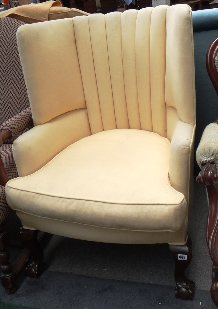 Appraisal: An th century style reeded tub back armchair on ball