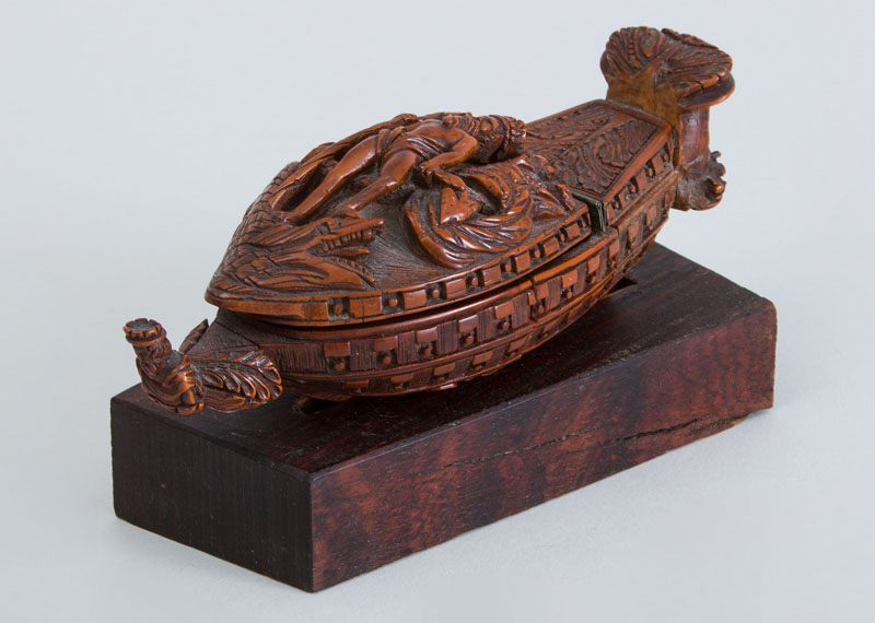 Appraisal: CONTINENTAL CARVED BOXWOOD SHIP-FORM SNUFF BOX The hinged lid with