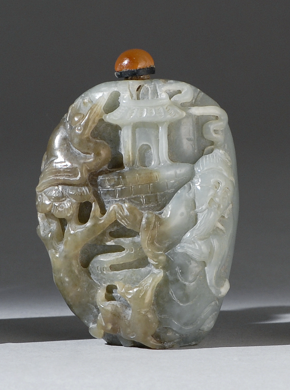 Appraisal: GRAY-GREEN JADE SNUFF BOTTLE th CenturyIn pebble form with relief-carved