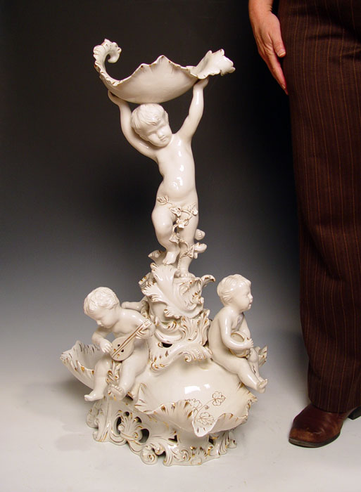 Appraisal: '' TALL ITALIAN PUTTI PORCELAIN CENTERPIECE A group of putti