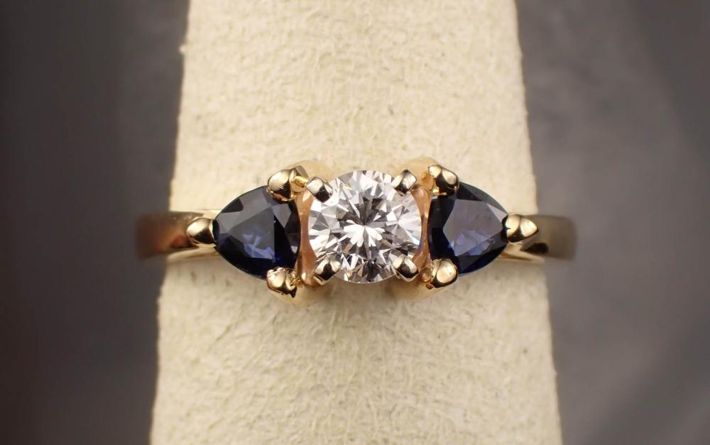 Appraisal: DIAMOND SAPPHIRE AND FOURTEEN KARAT GOLD RING The yellow gold