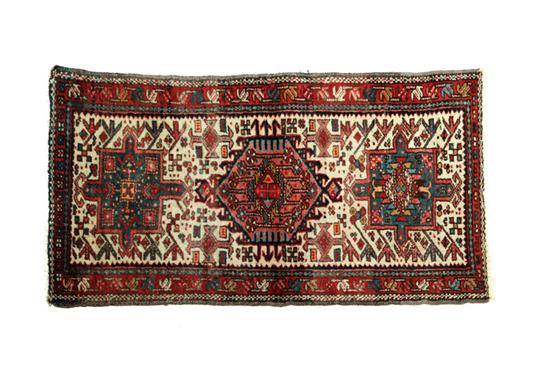 Appraisal: ORIENTAL RUG Karaja Red border and medallions on white ground