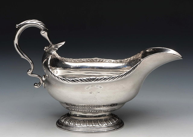 Appraisal: A GEORGE III SILVER SAUCE BOAT with gadrooned shaped edge