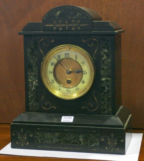 Appraisal: A French th century black Belgian marble mantle clock inlaid