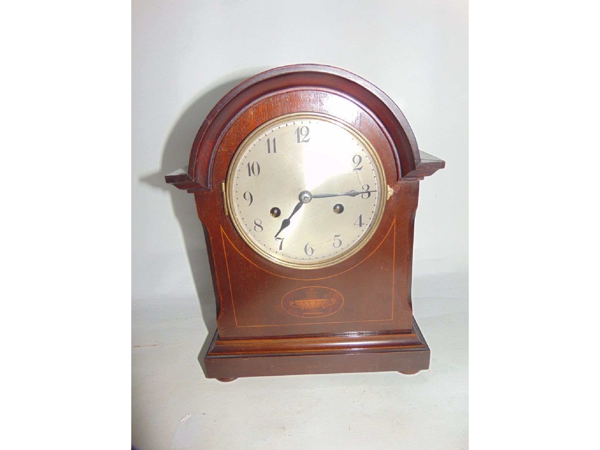 Appraisal: An inlaid Edwardian mahogany bracket clock with silvered dial and