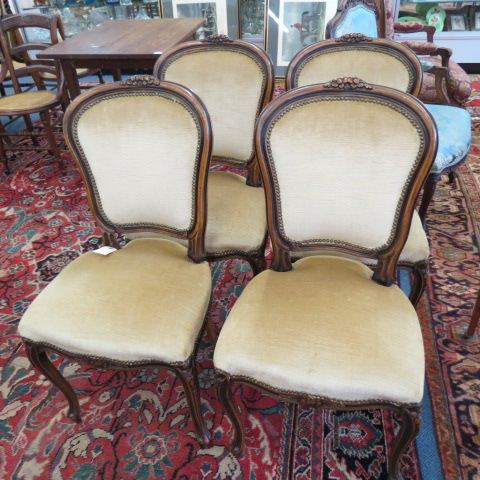 Appraisal: Carved French Chairs florals on back light tan velvet tall