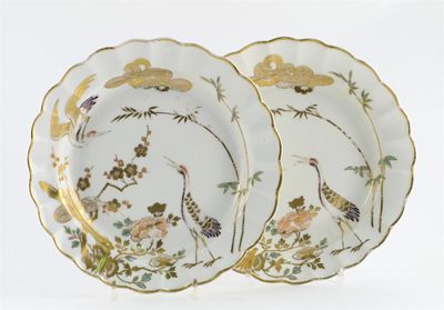 Appraisal: A pair of Derby Arita-style scallop-edged dishes painted and gilded