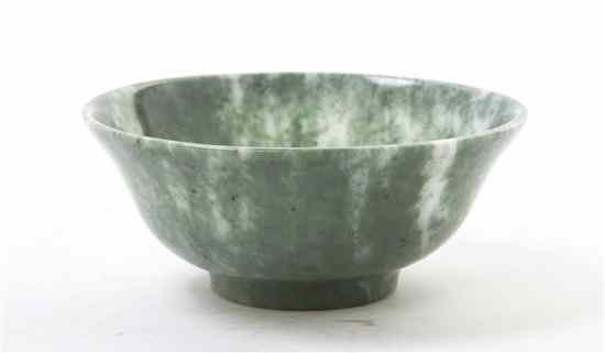 Appraisal: A Jade Bowl of green and white mottled stone of