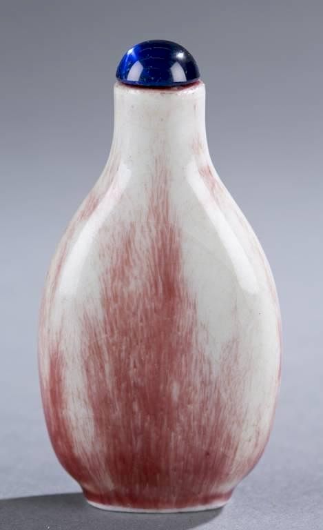 Appraisal: Chinese porcelain snuff bottle with red glaze A Chinese porcelain