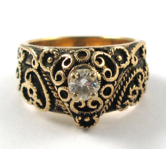 Appraisal: DIAMOND AND FOURTEEN KARAT GOLD RING set with a single