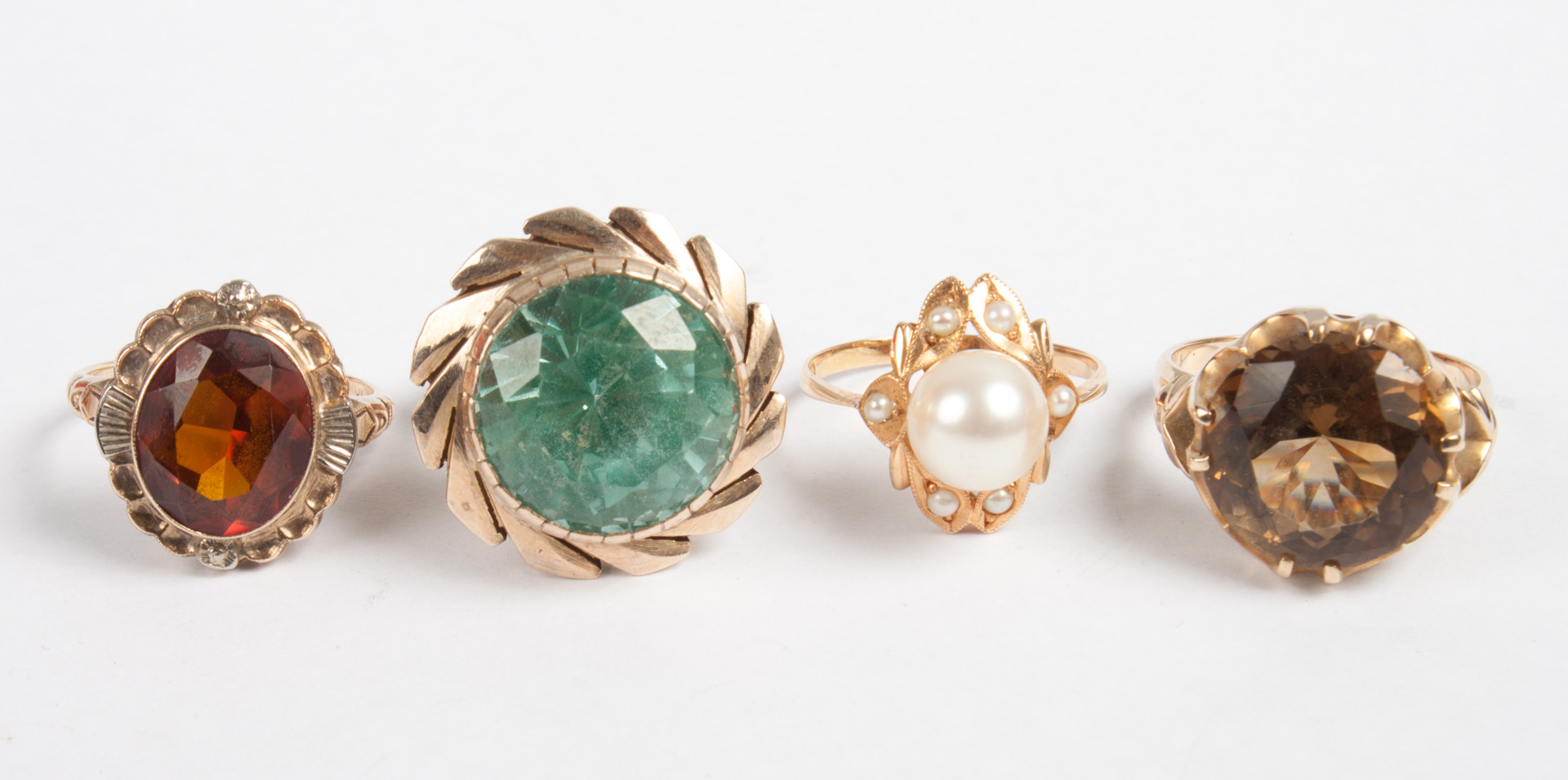 Appraisal: Four lady's gold and colored stone rings K gold blue