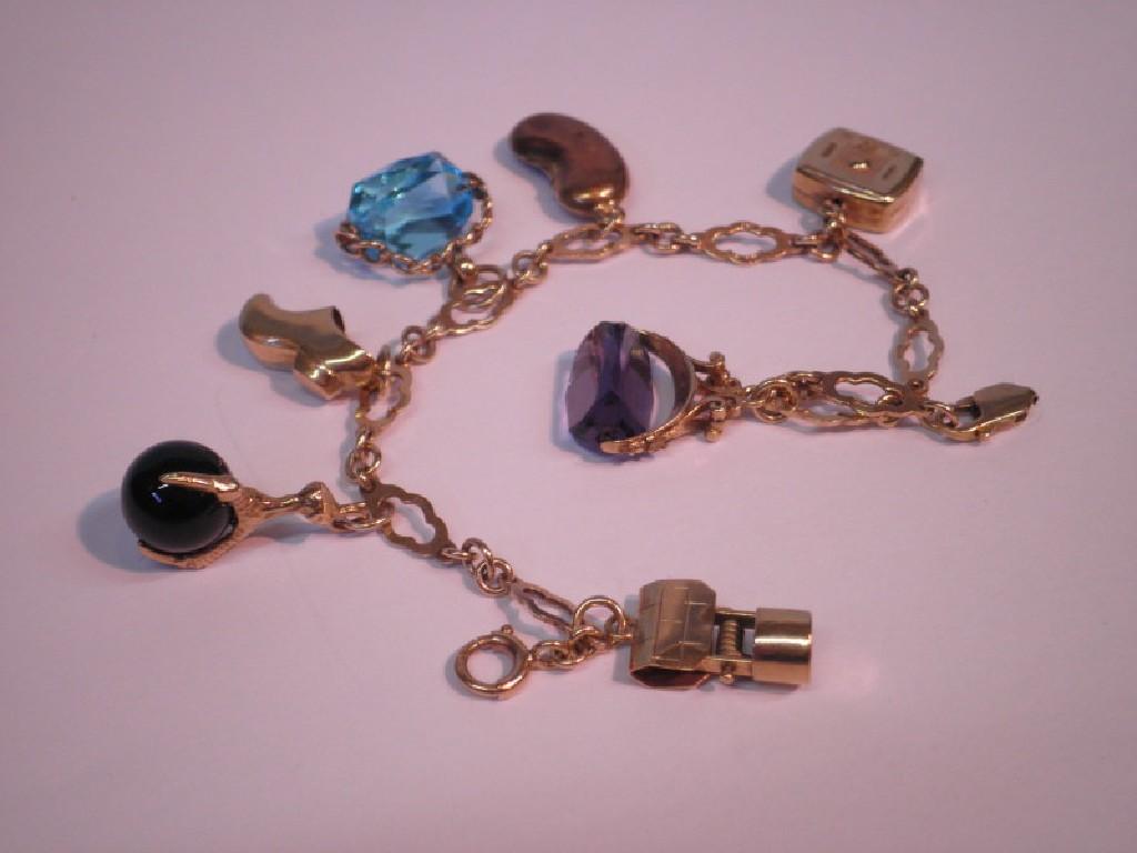 Appraisal: A fancy link charm bracelet with attached charms g