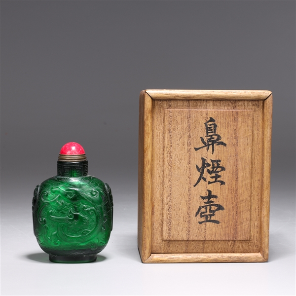 Appraisal: Chinese emerald green glass snuff bottle with cloud background animals