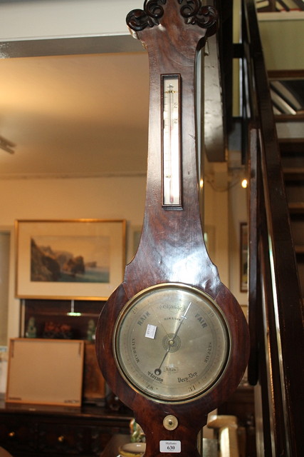 Appraisal: A VICTORIAN MAHOGANY BAROMETER with carved case and silvered dial