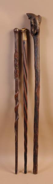 Appraisal: Lot of Hand Carved Walking Sticks This lot includes a