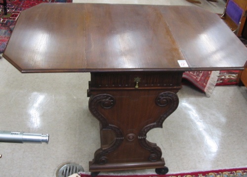 Appraisal: A THREE TIER WALNUT SERVING CART American c 's having