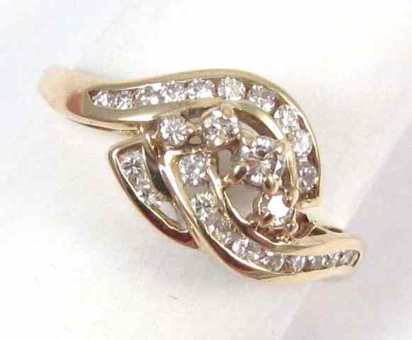 Appraisal: DIAMOND AND FOURTEEN KARAT GOLD RING yellow gold set with