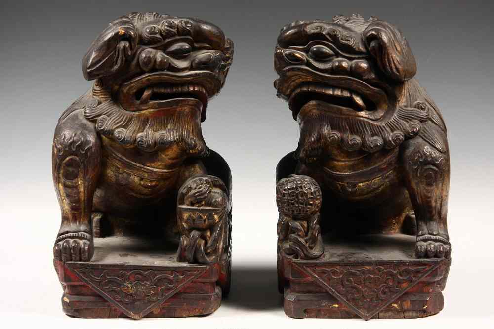 Appraisal: PAIR OF EARLY LACQUERED AND GILT FOO DOGS - Pair