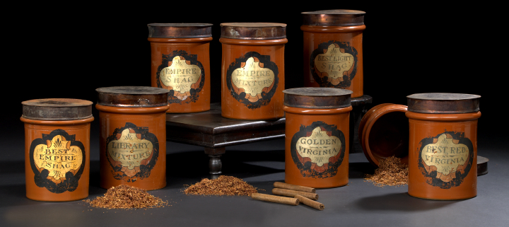 Appraisal: Unusual Collection of Eight Russet-Glazed Pottery Tobacconist Canisters with Wrought-Tin