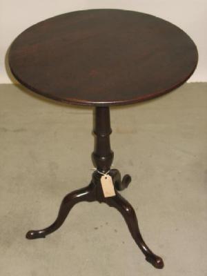 Appraisal: A GEORGE III MAHOGANY TRIPOD TABLE the circular tip up