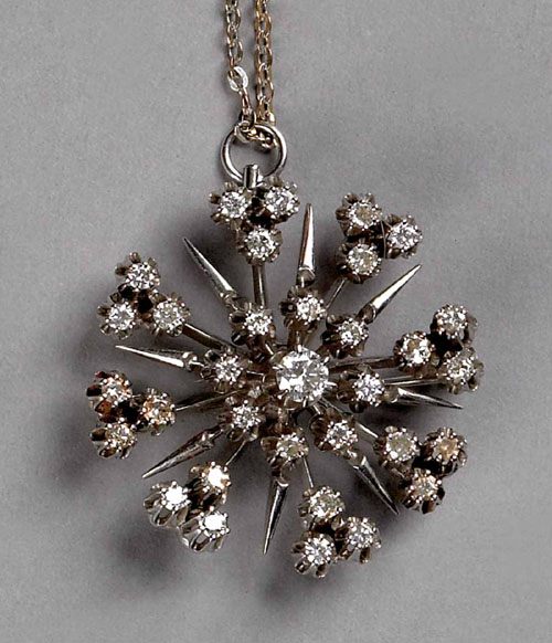 Appraisal: K white gold and diamond snowflake pendant with center round