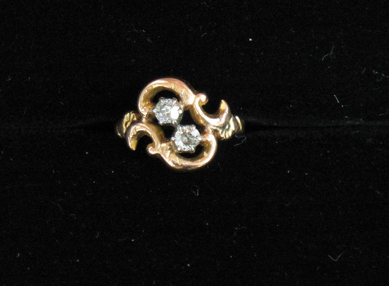 Appraisal: A VICTORIAN CHILD'S DIAMOND RING the two claw-set old-cut diamonds