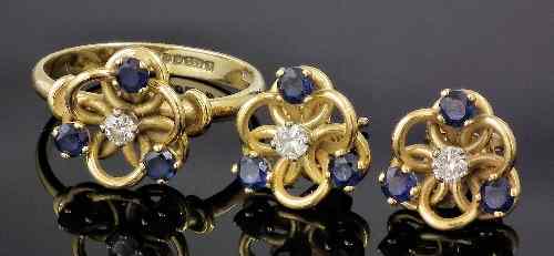 Appraisal: A modern ct gold mounted sapphire and diamond knot pattern