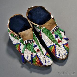 Appraisal: Lakota Beaded Hide Moccasins c s beaded with multicolored geometric