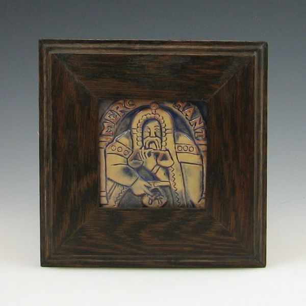 Appraisal: Moravian framed tile of a merchant holding scales and a