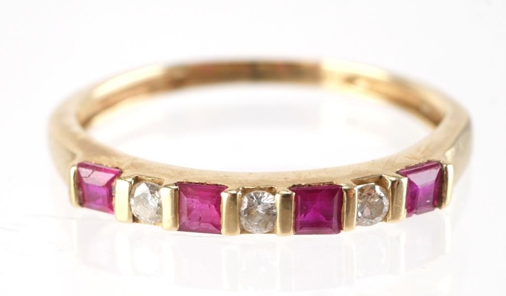 Appraisal: K yellow gold band with alternating rubies four and diamonds