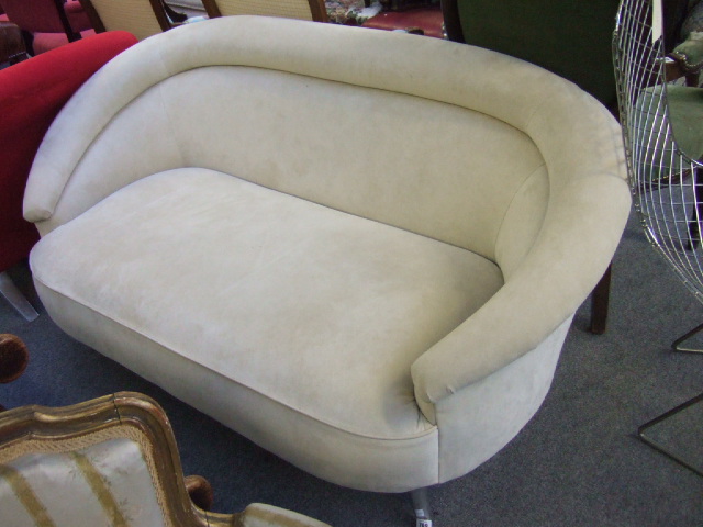 Appraisal: An Intermura ivory alcantara small two seat sofa cm wide