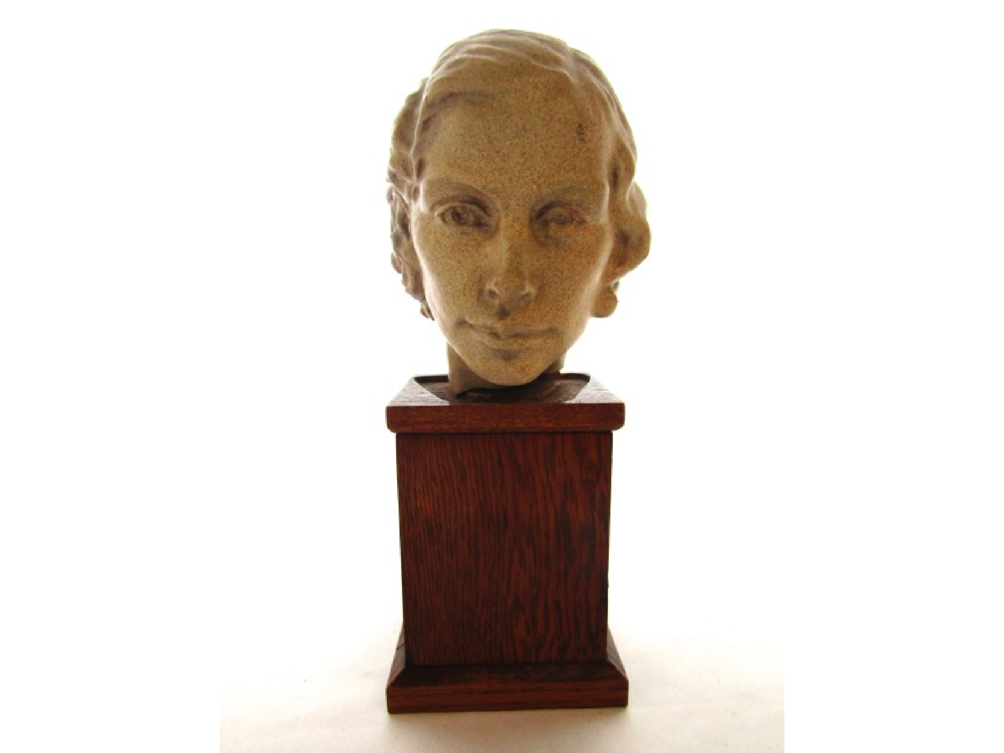 Appraisal: A finely worked ceramic head of a young woman mounted